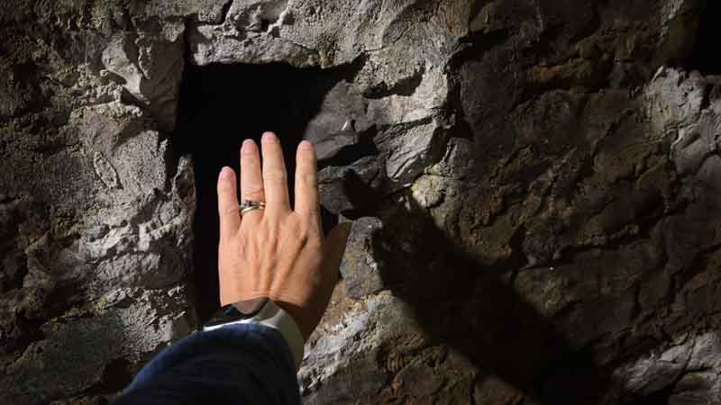 Hand in Front of Fleurine Roquefort Caves