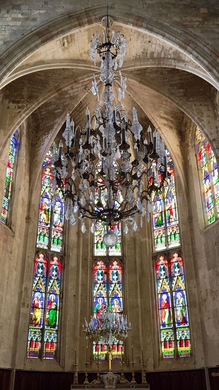 Stained Glass and Chandelier inside Vaulted ceiling inside La collégiale Saint-Étienne de Capestang