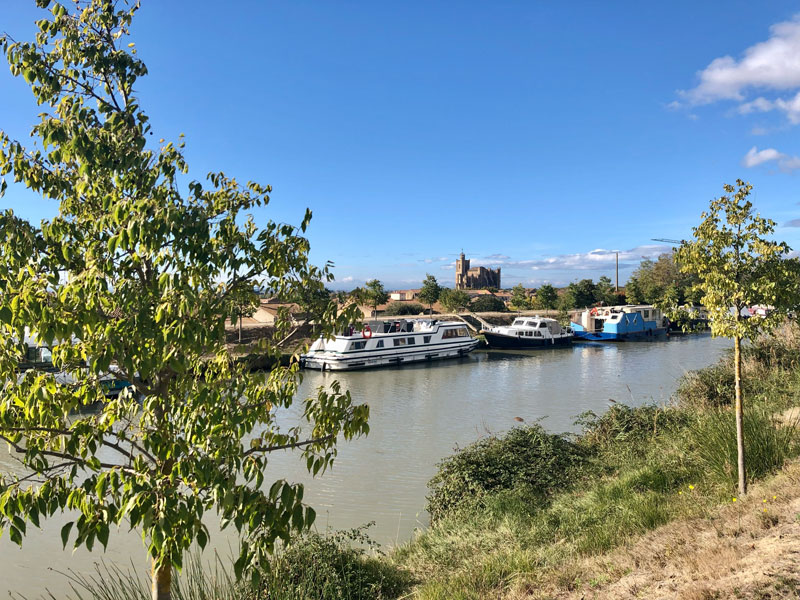 View of Capestang from towpath alongside Canal du Midi